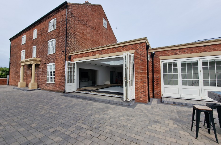 Accoya Bi-Folding Doors in Swimming Pool Extension.